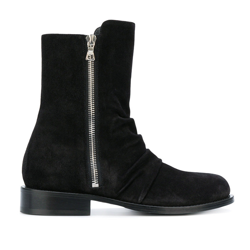 Bottes zippées homme en daim noir avec fermeture éclair latérale et bout amande, talon bas, vue de coté