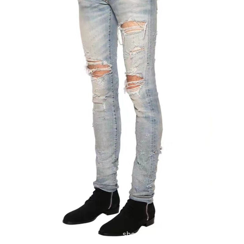 Bottes zippées homme en daim noir avec fermeture éclair latérale et bout amande, talon bas, vue latéral 
