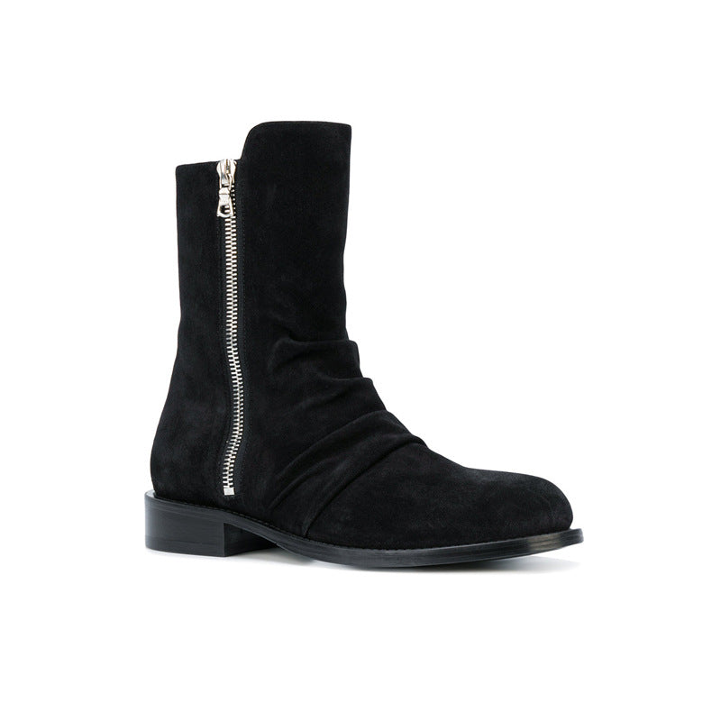 Bottes zippées homme en daim noir avec fermeture éclair latérale et bout amande, talon bas, vue latéral de l'avant