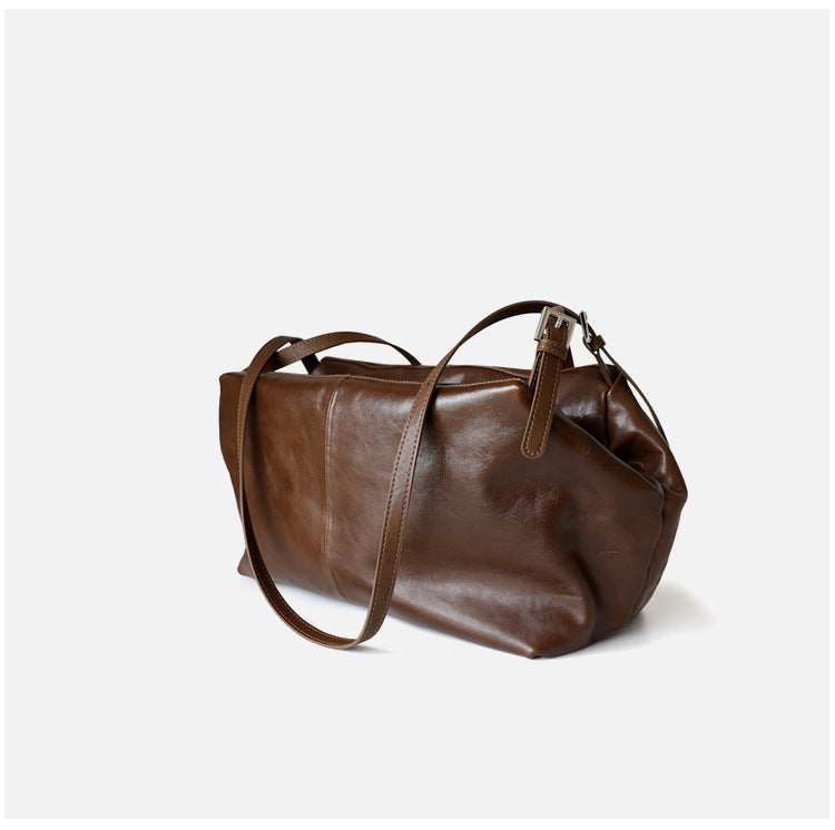 Grand sac unisex en cuir de vachette tanné végétal, taille petits et grands, coloris marron foncé, vue latéral