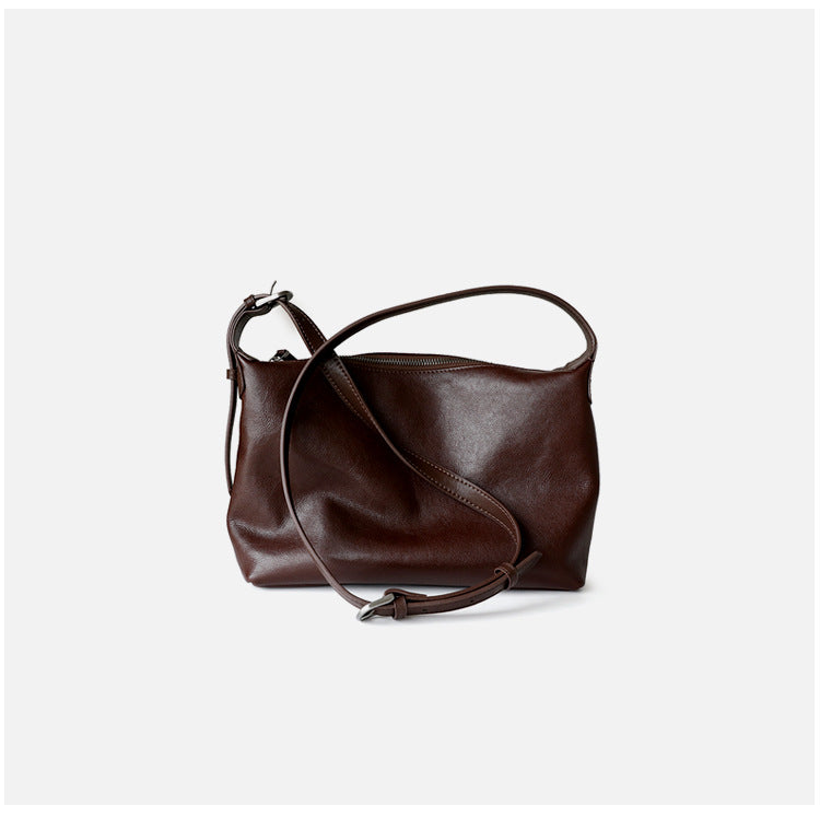Sac à main simple en cuir tanné végétal, coloris café, vue de dos.