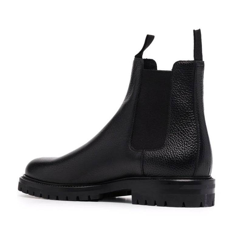 bottes chelsea noir en cuir véritable avec un bout rond et talon bas, vue de coté.